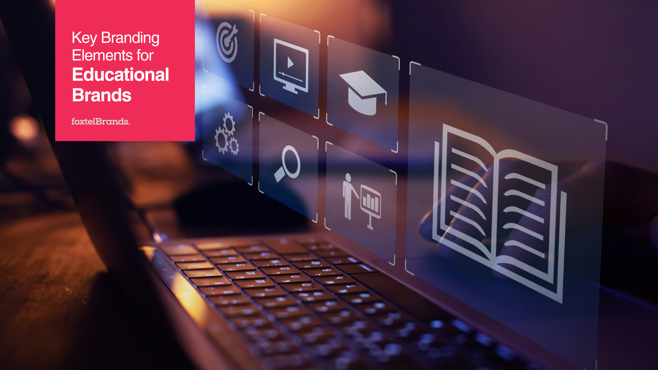 Laptop keyboard with educational branding icons and text that reads "Key Branding Elements for Educational Brands foxtelBrands."