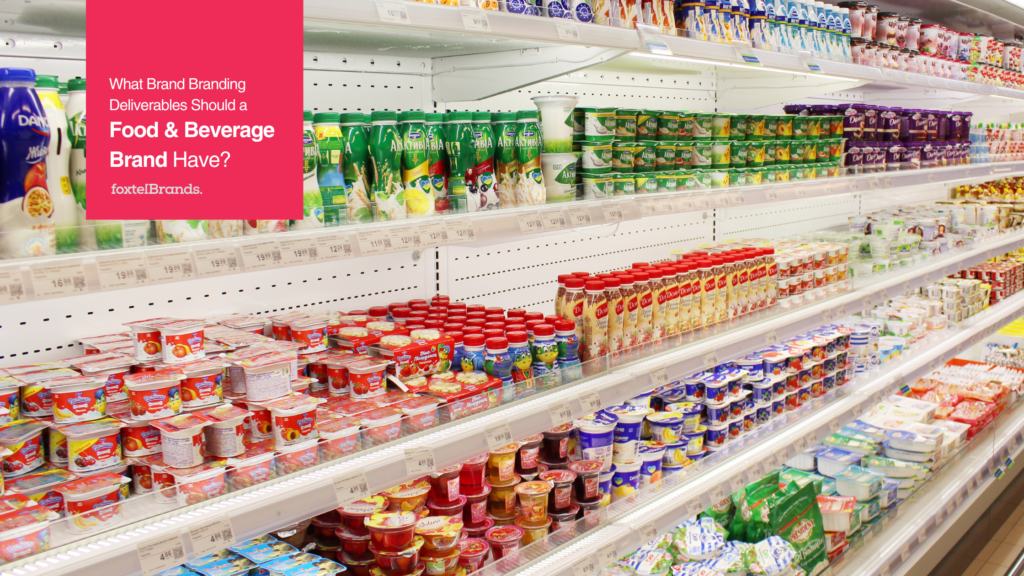Supermarket shelf filled with various dairy products, including yogurt, milk, and other packaged goods, organized neatly in rows with colorful packaging.