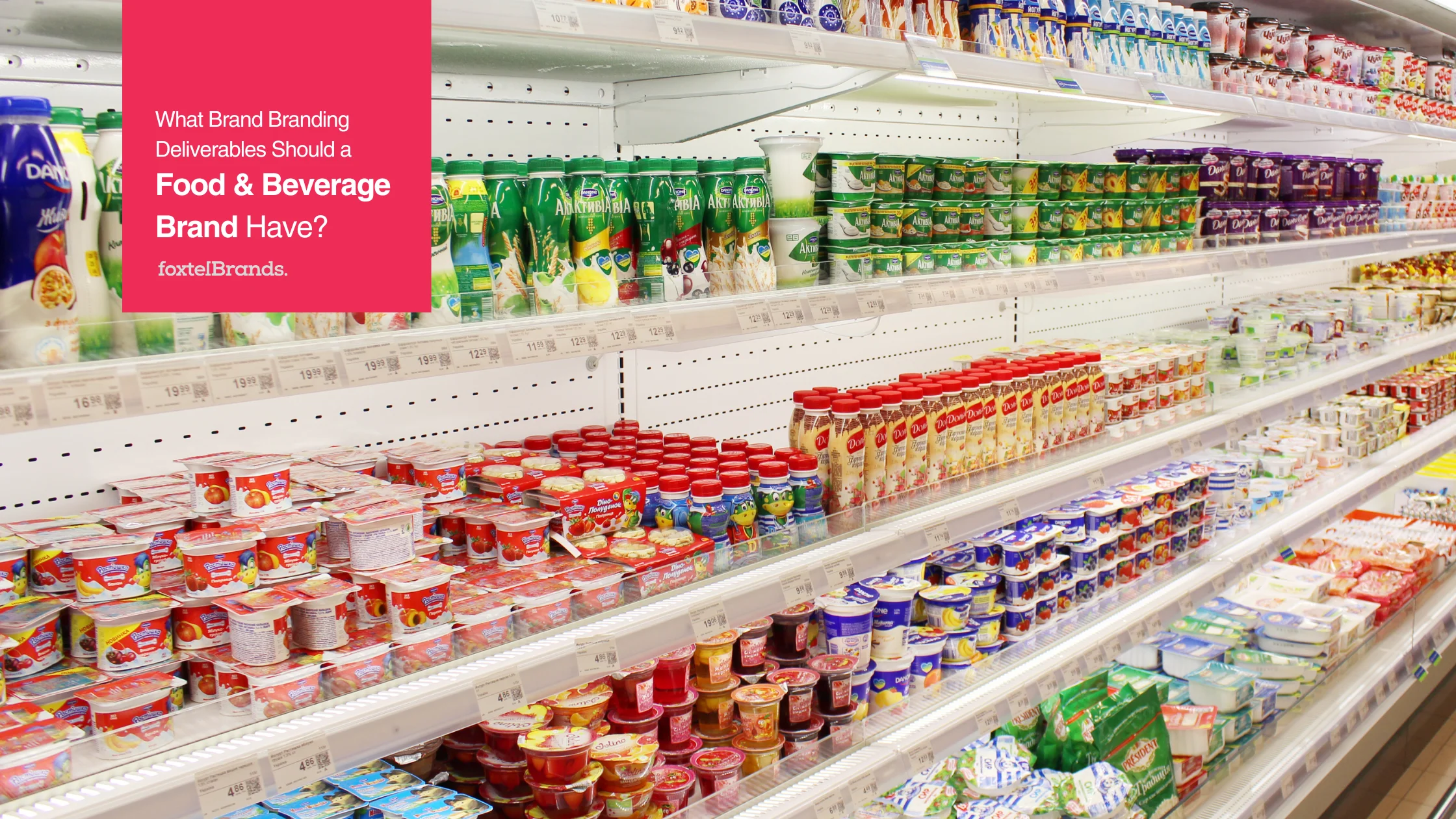 Supermarket shelf filled with various dairy products, including yogurt, milk, and other packaged goods, organized neatly in rows with colorful packaging.